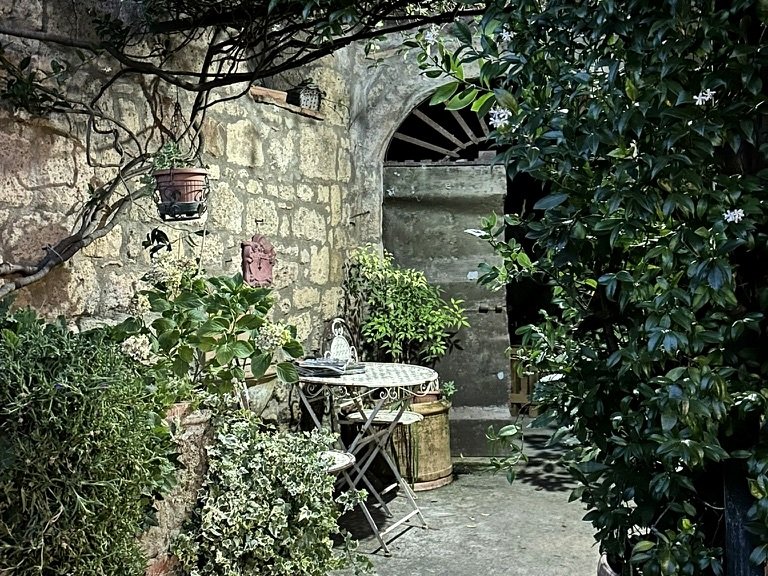 Charming stone courtyard with plants in Sorano Tuscany