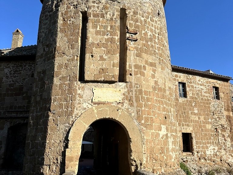 Tufa stone building and arched passage in Sorano Tuscany